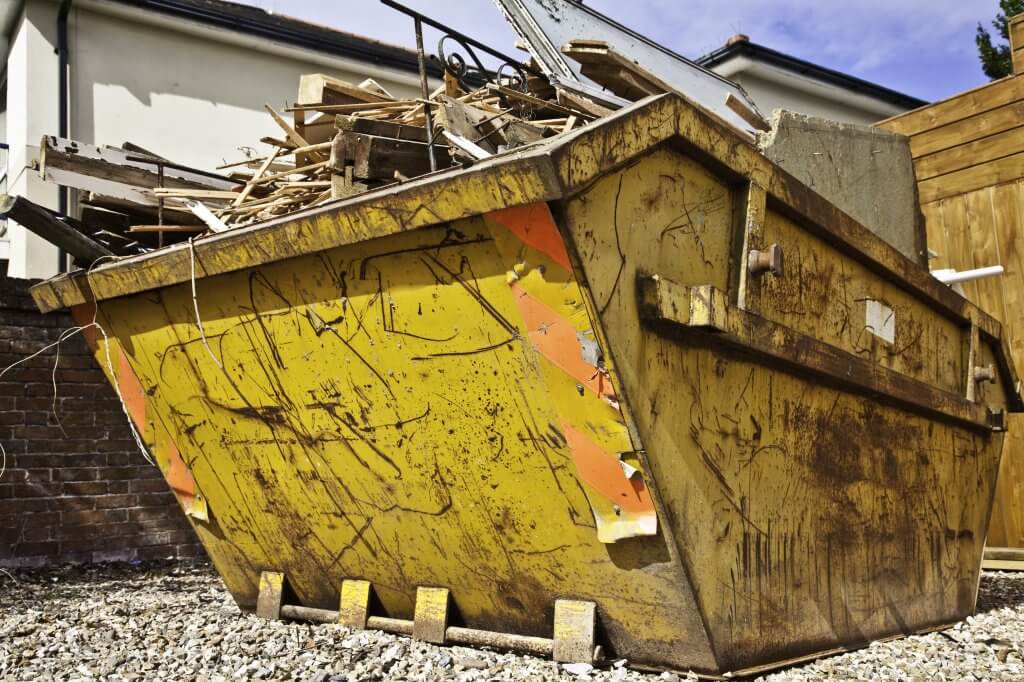 Skip loaded with waste
