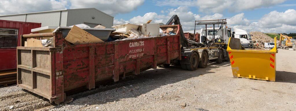 Commercial skip full with waste on construction site in Aylesbury